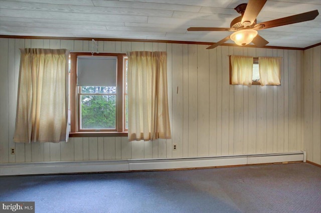 38 Mountain Rd, Orrtanna, PA 17353 - spare room with a baseboard radiator, carpet flooring, ceiling fan, and wooden walls