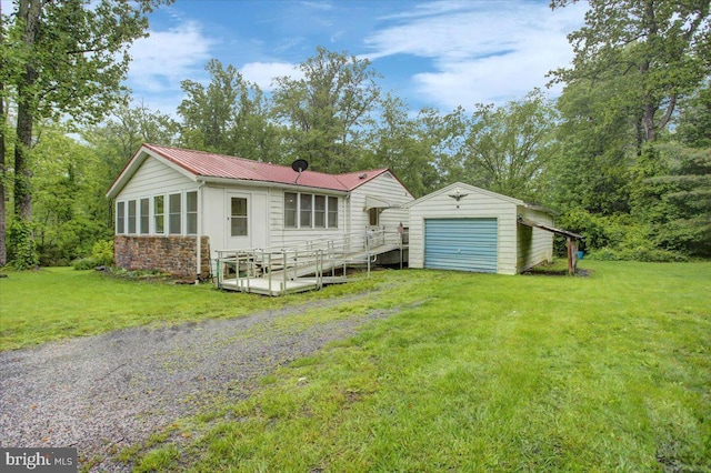 38 Mountain Rd, Orrtanna, PA 17353 - rear view of house with an outbuilding, a yard, a garage, and stone siding