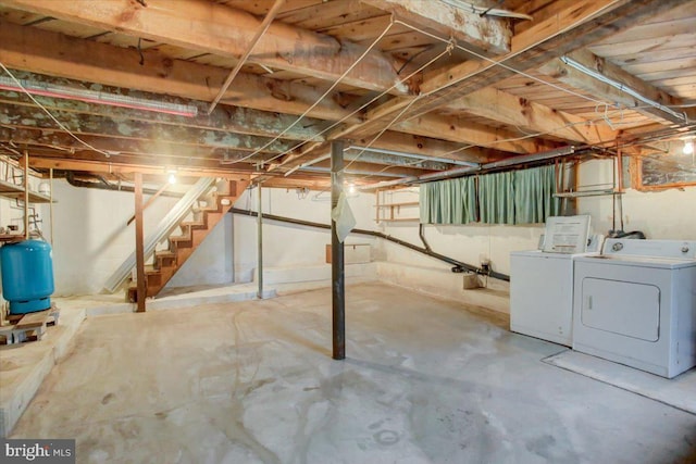 38 Mountain Rd, Orrtanna, PA 17353 - unfinished basement featuring washer and clothes dryer, a water pressure tank, and stairway