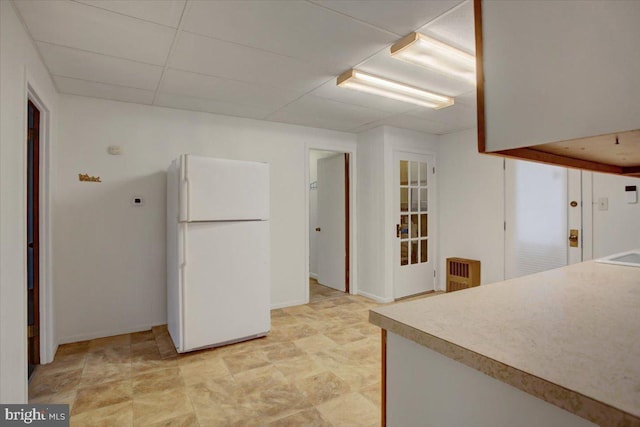 38 Mountain Rd, Orrtanna, PA 17353 - kitchen featuring freestanding refrigerator, radiator, baseboards, and light countertops