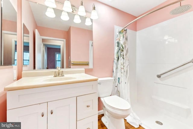 4105 Majestic Ln, Fairfax, VA 22033 - full bathroom featuring toilet, a shower with shower curtain, vanity, and wood finished floors