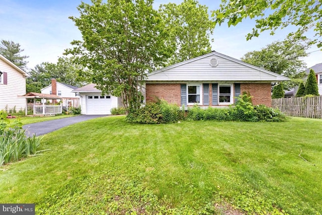 4105 Majestic Ln, Fairfax, VA 22033 - view of front of property with asphalt driveway, a garage, and brick siding
