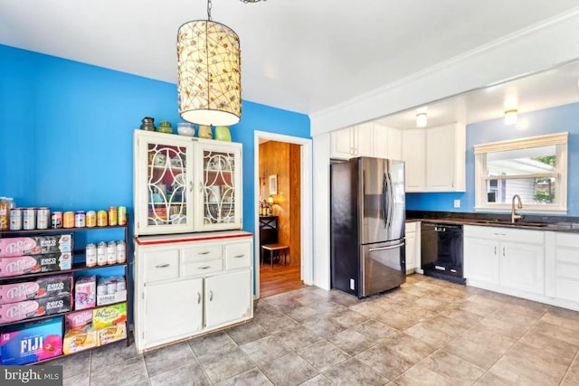 4105 Majestic Ln, Fairfax, VA 22033 - kitchen with freestanding refrigerator, black dishwasher, a sink, dark countertops, and white cabinetry