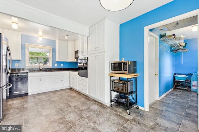 4105 Majestic Ln, Fairfax, VA 22033 - kitchen with appliances with stainless steel finishes, a sink, dark countertops, white cabinets, and light tile patterned floors