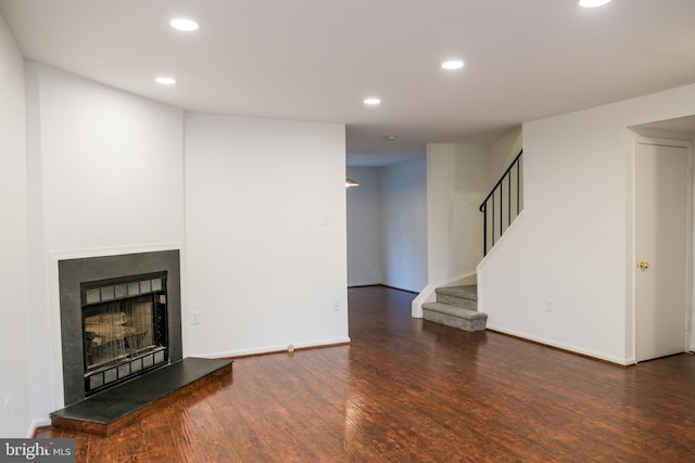 7619 S Arbory Ln Unit 339, Laurel, MD 20707 - unfurnished living room featuring wood finished floors, stairs, recessed lighting, and a fireplace with raised hearth