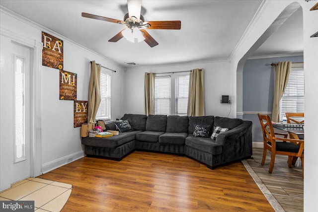 121 Emanuel St, Hamilton, NJ 08610 - living area with a ceiling fan, wood finished floors, ornamental molding, baseboards, and arched walkways