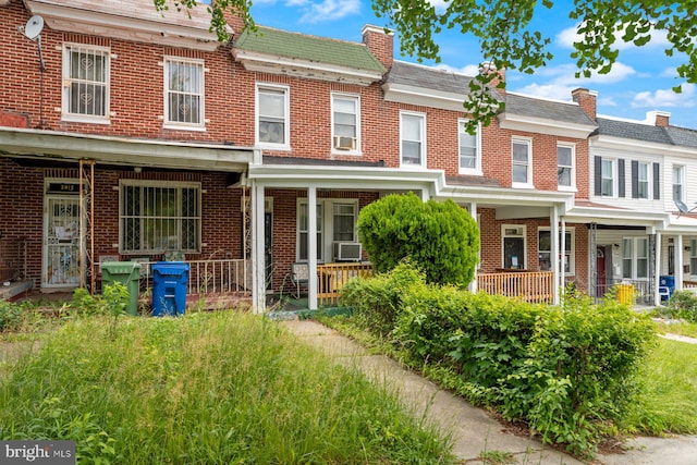 2810 Ellicott Dr, Baltimore, MD 21216 - townhome / multi-family property with brick siding and covered porch