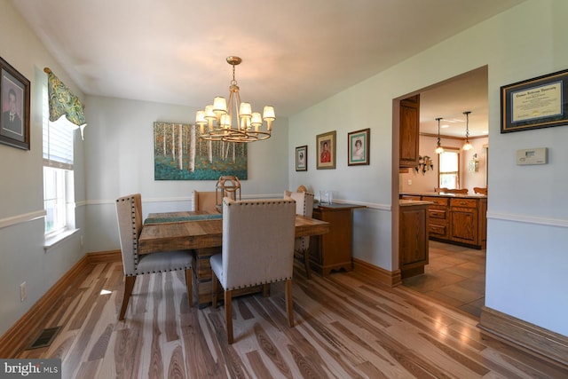 12 Ethan Ter, Woolwich Twp, NJ 08085 - dining room featuring a chandelier, wood finished floors, plenty of natural light, and baseboards