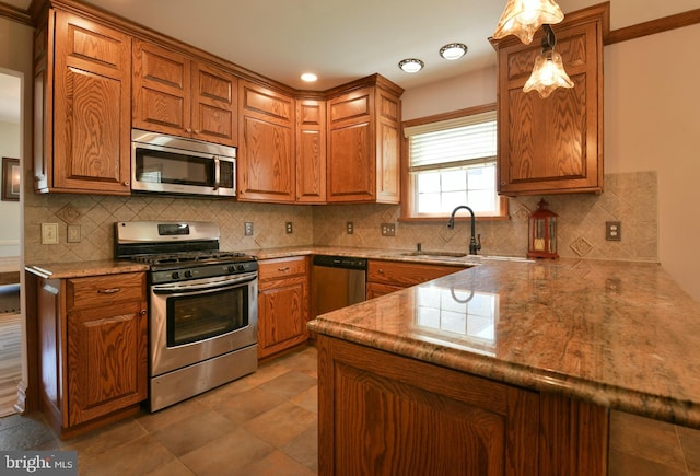 12 Ethan Ter, Woolwich Twp, NJ 08085 - kitchen featuring appliances with stainless steel finishes, a sink, and brown cabinets