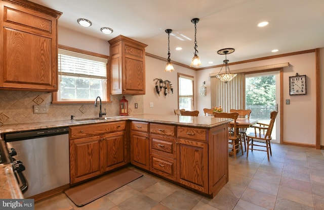 12 Ethan Ter, Woolwich Twp, NJ 08085 - kitchen featuring stainless steel dishwasher, a sink, a peninsula, brown cabinets, and decorative backsplash