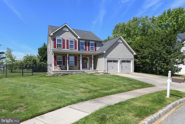 12 Ethan Ter, Woolwich Twp, NJ 08085 - view of front facade with covered porch, concrete driveway, a garage, and stone siding