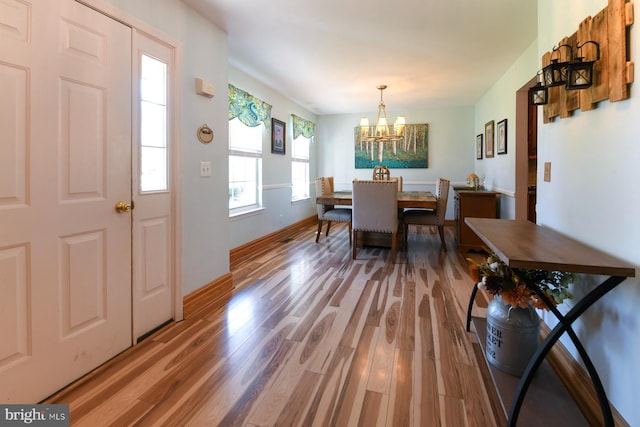 12 Ethan Ter, Woolwich Twp, NJ 08085 - dining room with a chandelier, wood finished floors, and baseboards