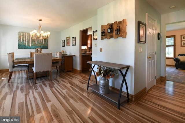 12 Ethan Ter, Woolwich Twp, NJ 08085 - dining area featuring light wood-style floors, a chandelier, and baseboards
