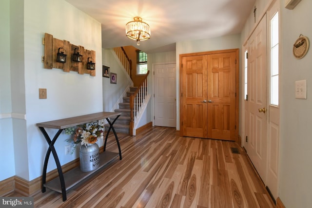 12 Ethan Ter, Woolwich Twp, NJ 08085 - foyer with light wood-style floors, stairs, a chandelier, and baseboards