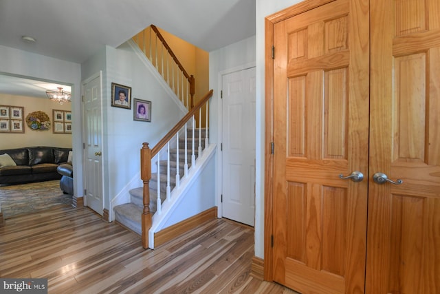 12 Ethan Ter, Woolwich Twp, NJ 08085 - stairway with wood finished floors, baseboards, and a chandelier