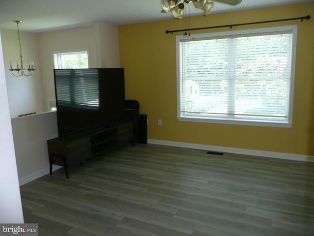 2602 Avenue E Ave E, Levittown, PA 19056 - living room featuring a chandelier, baseboards, and wood finished floors
