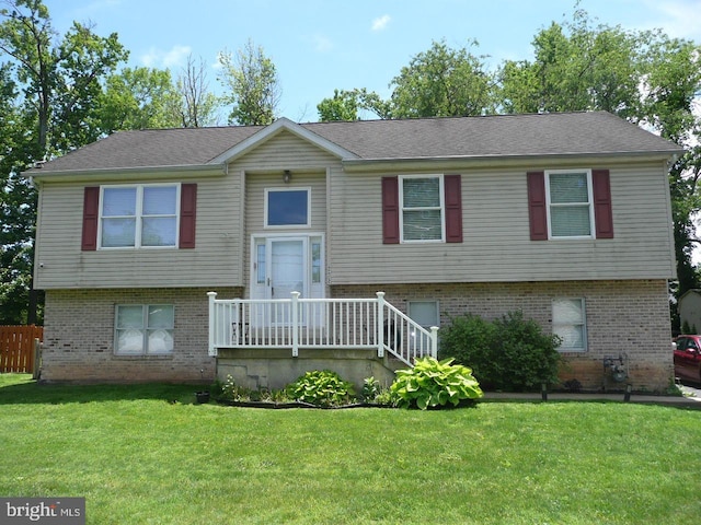2602 Avenue E Ave E, Levittown, PA 19056 - raised ranch with brick siding and a front lawn
