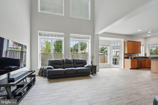 8313 Middle Ruddings Dr, Lorton, VA 22079 - living room with a high ceiling, light wood-type flooring, and recessed lighting