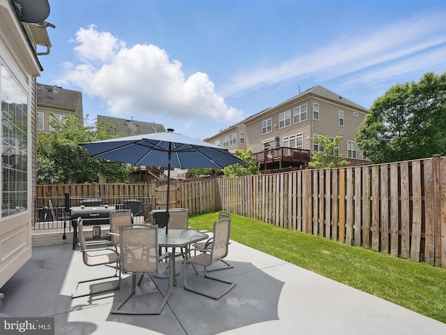 8313 Middle Ruddings Dr, Lorton, VA 22079 - fenced backyard featuring a patio and outdoor dining area