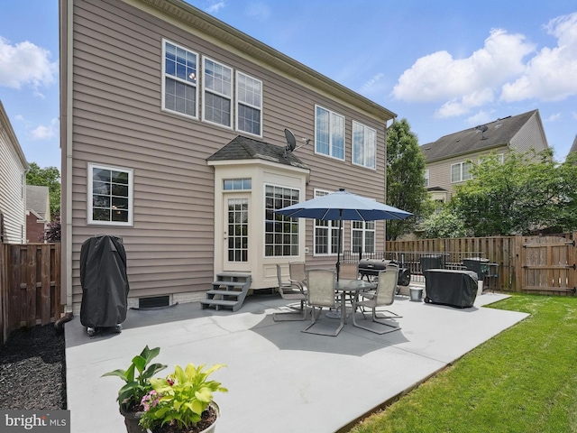 8313 Middle Ruddings Dr, Lorton, VA 22079 - back of property with entry steps, a fenced backyard, and a patio area