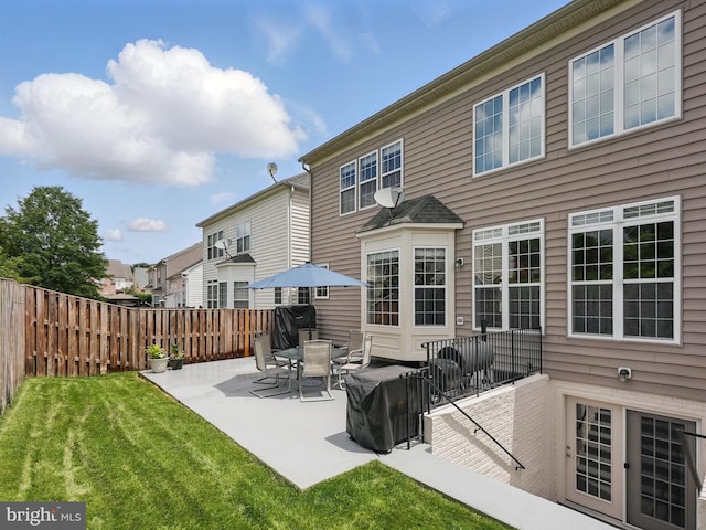 8313 Middle Ruddings Dr, Lorton, VA 22079 - back of house featuring a patio and a residential view