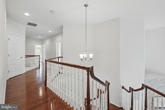 8313 Middle Ruddings Dr, Lorton, VA 22079 - hall with an upstairs landing, a chandelier, wood finished floors, recessed lighting, and baseboards