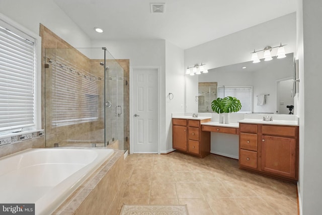 8313 Middle Ruddings Dr, Lorton, VA 22079 - full bath with double vanity, a garden tub, a stall shower, tile patterned floors, and plenty of natural light