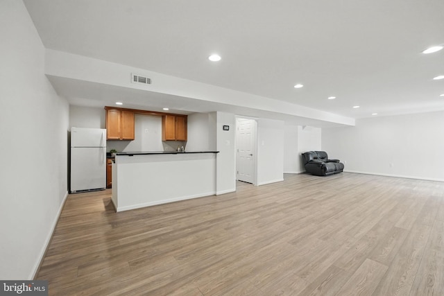 8313 Middle Ruddings Dr, Lorton, VA 22079 - unfurnished living room with recessed lighting, baseboards, and light wood-type flooring