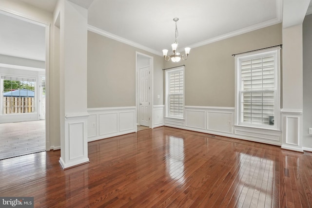 8313 Middle Ruddings Dr, Lorton, VA 22079 - unfurnished dining area with a chandelier, hardwood / wood-style flooring, wainscoting, and crown molding