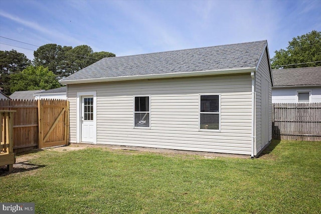 511 Goldsborough Ave, Cambridge, MD 21613 - back of house with a shingled roof and a gate