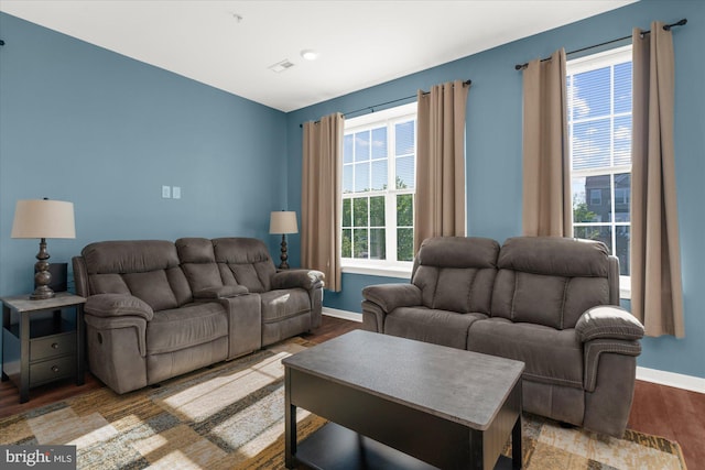 living area featuring wood finished floors and baseboards