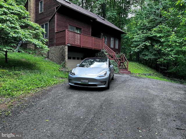448 Newton Dr, Linden, VA 22642 - rustic home with an attached garage, stairs, asphalt driveway, roof with shingles, and stone siding