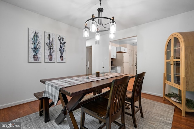 448 Newton Dr, Linden, VA 22642 - dining room with a chandelier, wood finished floors, and baseboards