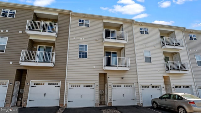 3073 Goshen Dr Unit M55L, Pennsburg, PA 18073 - view of apartment building / complex featuring an attached garage and driveway