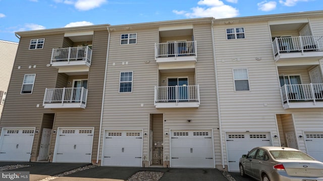 3073 Goshen Dr Unit M55L, Pennsburg, PA 18073 - view of apartment building / complex with an attached garage and driveway