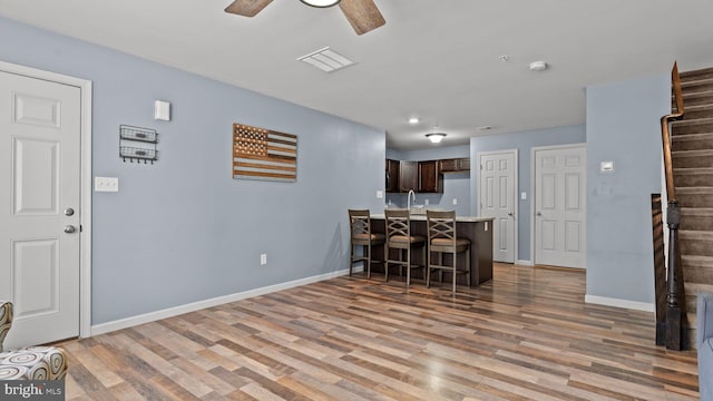 3073 Goshen Dr Unit M55L, Pennsburg, PA 18073 - kitchen with light countertops, light wood finished floors, a peninsula, and dark brown cabinets