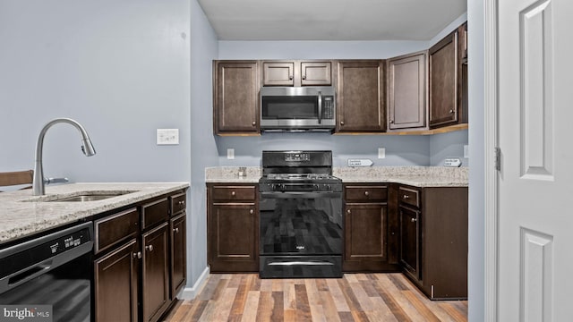 3073 Goshen Dr Unit M55L, Pennsburg, PA 18073 - kitchen featuring stainless steel microwave, black range with gas cooktop, dishwashing machine, a sink, and dark brown cabinetry