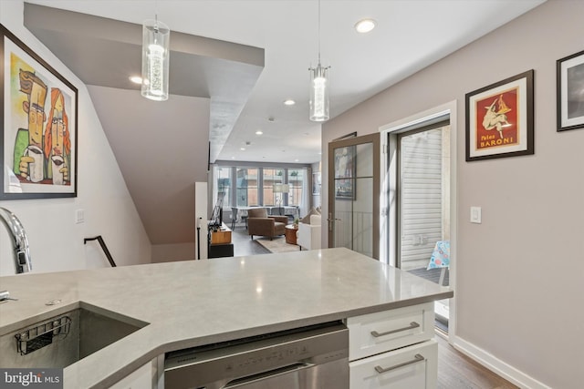 528 S 5th St Unit 1F, Philadelphia, PA 19147 - kitchen featuring dishwasher, a sink, recessed lighting, white cabinetry, and light countertops