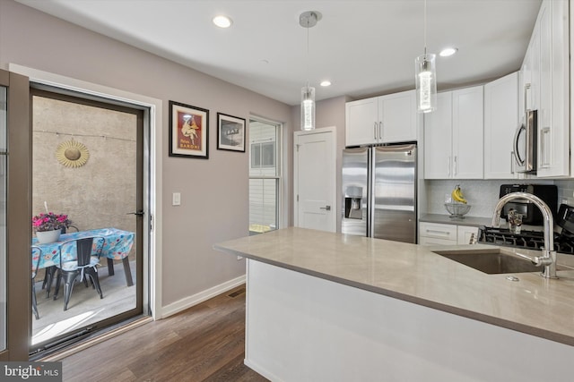 528 S 5th St Unit 1F, Philadelphia, PA 19147 - kitchen featuring appliances with stainless steel finishes, a sink, white cabinets, and recessed lighting