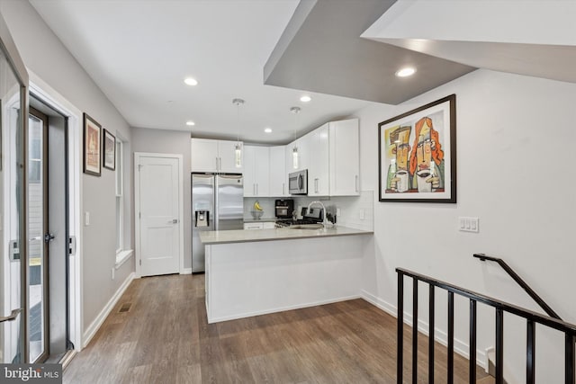 528 S 5th St Unit 1F, Philadelphia, PA 19147 - kitchen with a sink, appliances with stainless steel finishes, a peninsula, dark wood-style flooring, and recessed lighting