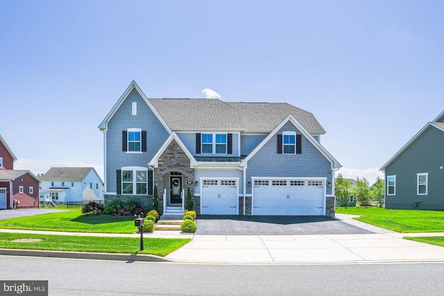 878 Sweet Birch Dr, Middletown, DE 19709 - craftsman-style house featuring stone siding, driveway, and a front yard