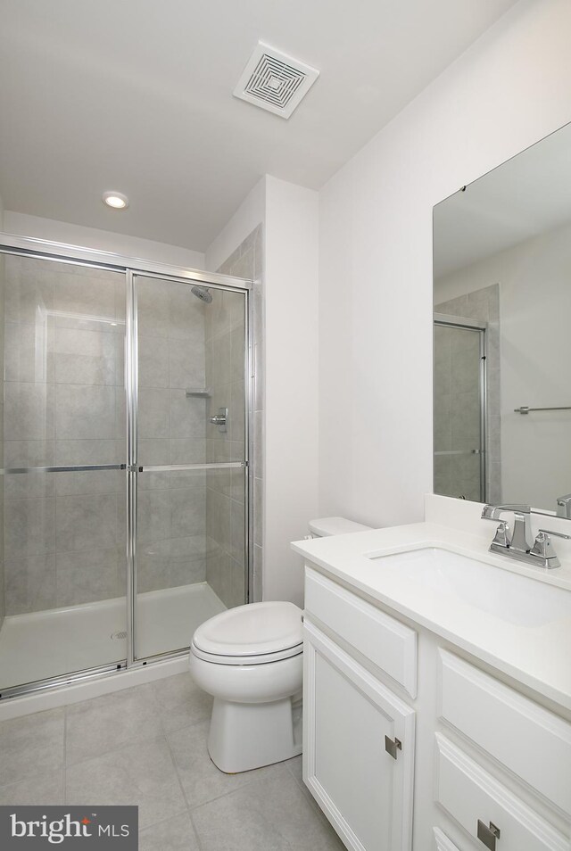 878 Sweet Birch Dr, Middletown, DE 19709 - bathroom with tile patterned floors, vanity, toilet, a stall shower, and recessed lighting