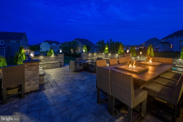 878 Sweet Birch Dr, Middletown, DE 19709 - patio at night with an outdoor fire pit and a patio area