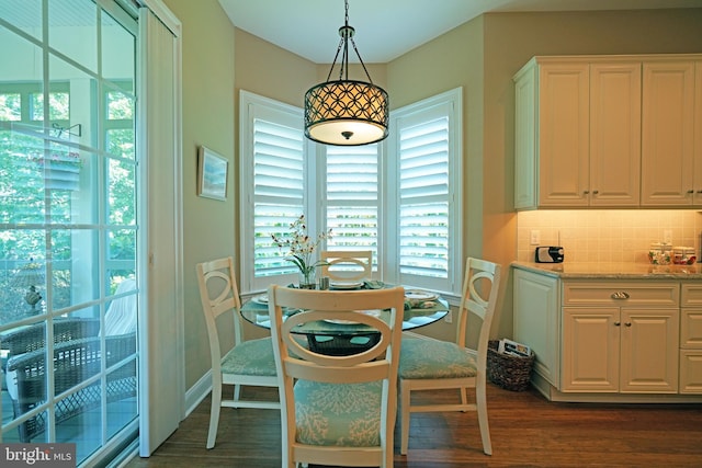 322 Captains Cir, Lewes, DE 19958 - dining space with dark wood-style flooring and baseboards