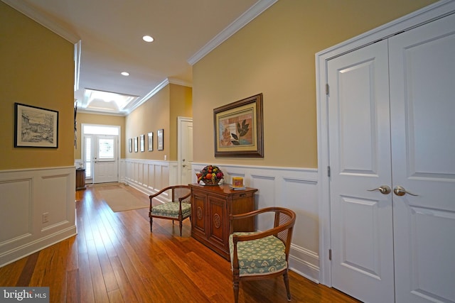 322 Captains Cir, Lewes, DE 19958 - hallway featuring crown molding, a wainscoted wall, wood-type flooring, a decorative wall, and recessed lighting