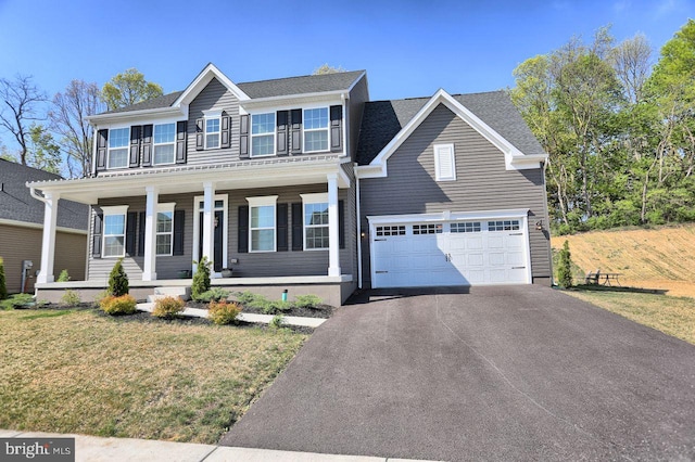 2005 Benjamin Ct, Harrisburg, PA 17110 - view of front facade with asphalt driveway, covered porch, a garage, and a front lawn