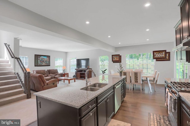 2005 Benjamin Ct, Harrisburg, PA 17110 - kitchen featuring stainless steel appliances, wood finished floors, recessed lighting, light stone countertops, and a center island with sink