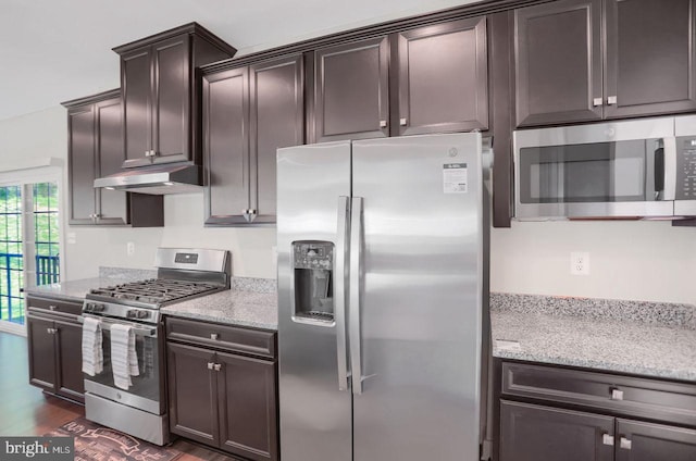 2005 Benjamin Ct, Harrisburg, PA 17110 - kitchen featuring stainless steel appliances, under cabinet range hood, light stone counters, and dark brown cabinets