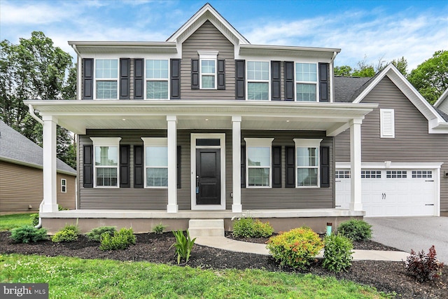 2005 Benjamin Ct, Harrisburg, PA 17110 - view of front of house with a porch, asphalt driveway, and an attached garage