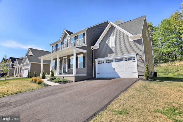 2005 Benjamin Ct, Harrisburg, PA 17110 - view of front of house with a porch, asphalt driveway, a front yard, and a garage